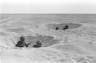 SINAI DESERT, EGYPT – OCTOBER 14: (FILE PHOTO) Israeli soldiers take cover in their foxholes during fighting against the Egyptians October 14, 1973 in the Sinai Desert during the Yom Kippur War. Israeli Prime Minister Ariel Sharon, then an Israeli general, refused to rule out another surprise attack similar to the one launched by the Arab armies when they struck against Israeli troops in the Sinai Desert and Golan Heights on the holiest day of the Jewish calendar on October 6, 1973. (Photo by GPO/Getty Images)