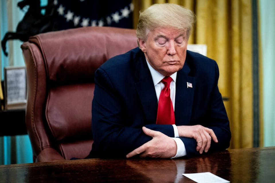 WASHINGTON, DC – MAY 01: U.S. President Donald Trump sits a the Resolute Desk while announcing that the Food and Drug Administration issued an emergency approval for the antiviral drug remdesivir in the Oval Office at the White House May 01, 2020 in Washington, DC. A federal government trial found that patients with COVID-19 receiving Gilead Sciences’ remdesivir recovered more quickly but the drug did not significantly reduce fatality rates. (Photo by Erin Schaff-Pool/Getty Images)