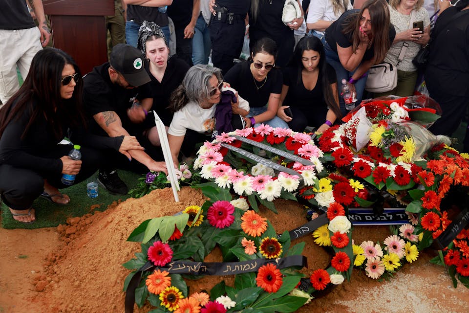 Relatives and friends grieve during the funeral of Israeli soldier Almog Shalom in Mount Herzl Military Cemetery in Jerusalem on June 11, 2024. *MENAHEM KAHANA/AFP via Getty Images.* Relatives and friends grieve at the grave during the funeral of Israeli soldier Almog Shalom in Mount Herzl Military Cemetery in Jerusalem on June 11, 2024, the day after he was killed with three other soldiers in the Gaza Strip, amid the ongoing conflict between Israel and the Palestinian Hamas militant group. The Israeli military said that four soldiers had been killed in fighting in southern Gaza on June 10, more than eight months into its war against Hamas militants. The soldiers were “killed in fighting in south Gaza” the military said in a statement, without elaborating on the circumstances of their deaths. (Photo by Menahem Kahana / AFP) (Photo by MENAHEM KAHANA/AFP via Getty Images)