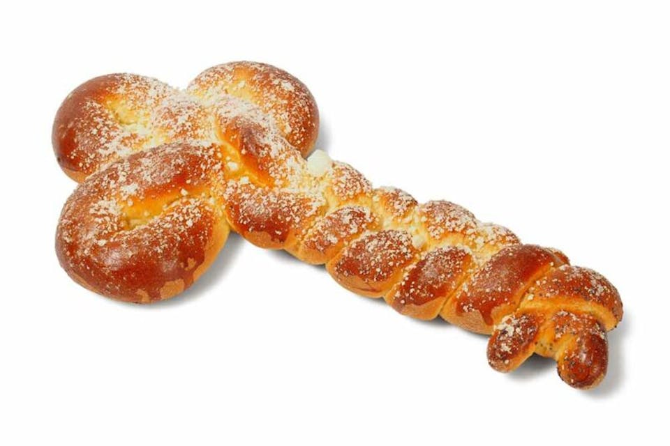 *Shutterstock.* Challah in a shape of key on white background