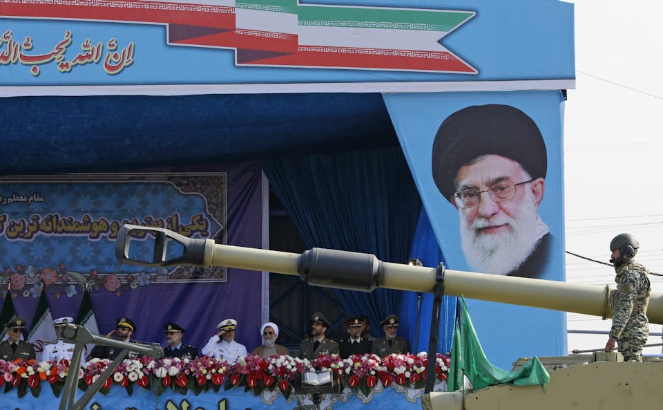 An Iranian army tank rolls past the tribune decorated with a portrait of Iran’s Supreme Leader Ayatollah Ali Khamenei during a parade on the occasion of the country’s annual army day on April 18, 2018 in Tehran. – President Hassan Rouhani said during the parade that Iran “does not intend any aggression” against its neighbours but will continue to produce all the weapons it needs for its defence. (Photo by ATTA KENARE / AFP) (Photo by ATTA KENARE/AFP via Getty Images)