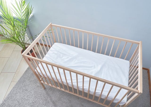 Baby,Bed,Top,View.,A,Bright,Room,With,A,Green