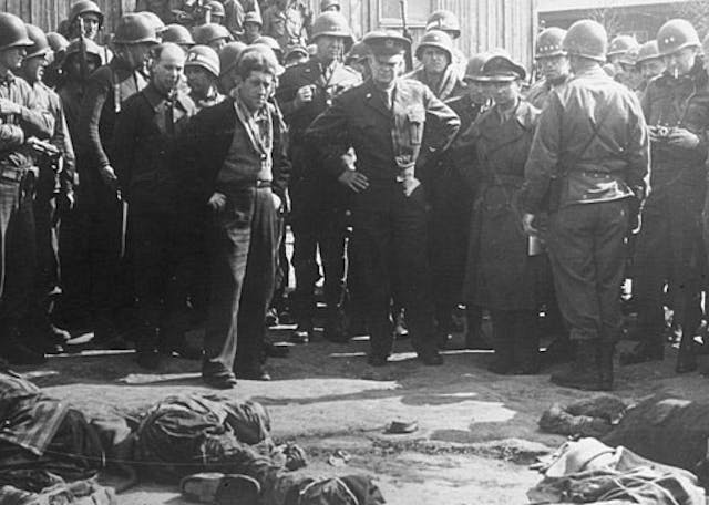 640px-Gen_Eisenhower_at_death_camp_report_crop