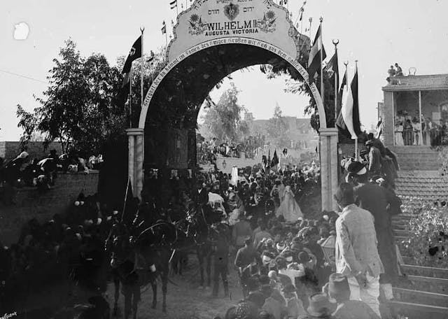 KaiserPassingUnderArch