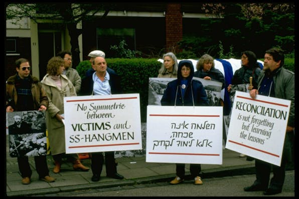 Jews in Berlin protest Ronald Reagan's visit to the Bitburg cemetery. *Sahm Doherty/Getty Images*. Demonstrators w. signs at Jewish protest in remembrance of Holocaust, against Pres. Ronald Reagan’s visit to Bitburg cemetery outside CDU HQ (Photo by Sahm Doherty/Getty Images)