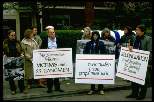 Demonstrators w. signs at Jewish protest in remembrance of Holocaust, against Pres. Ronald Reagan’s visit to Bitburg cemetery outside CDU HQ    (Photo by Sahm Doherty/Getty Images)