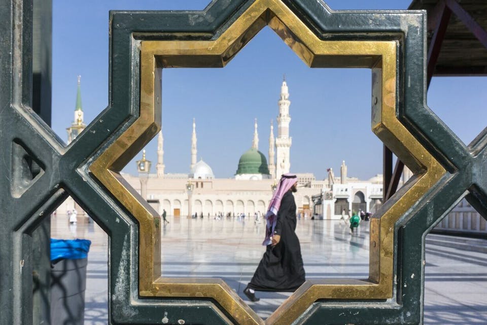 A man walks through the Nabawi mosque compound in Medina, Saudi Arabia (December 18, 2014). *Shutterstock.* sa-magen-david