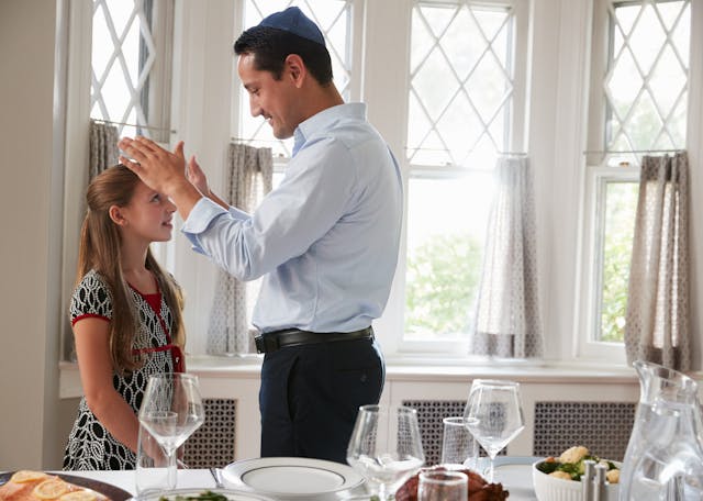 Jewish,Father,Blesses,Daughter,By,Table,Set,For,Shabbat,Meal