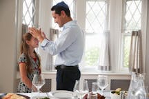 Jewish,Father,Blesses,Daughter,By,Table,Set,For,Shabbat,Meal