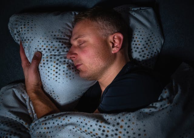 Man,Sleeps,Happily,And,Contentedly,On,His,Side,In,A