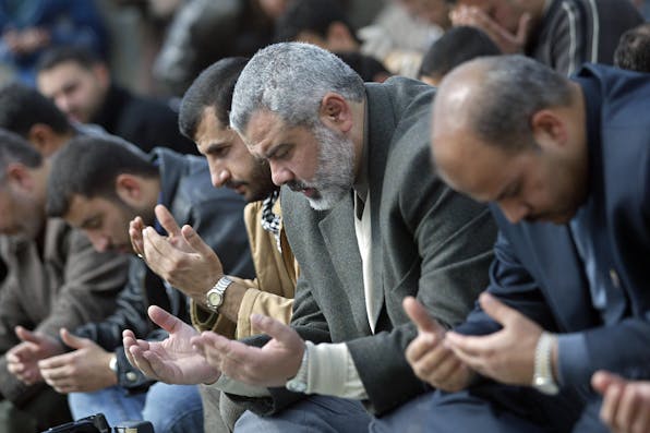 Former Hamas head Ismail Haniyeh praying, 2006. Mahmud Hams/AFP via Getty Images. Ismail Haniyeh praying.