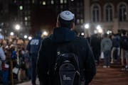 A Jewish student watches an anti-Israel protest at Columbia University in November 2023 *Getty Images*