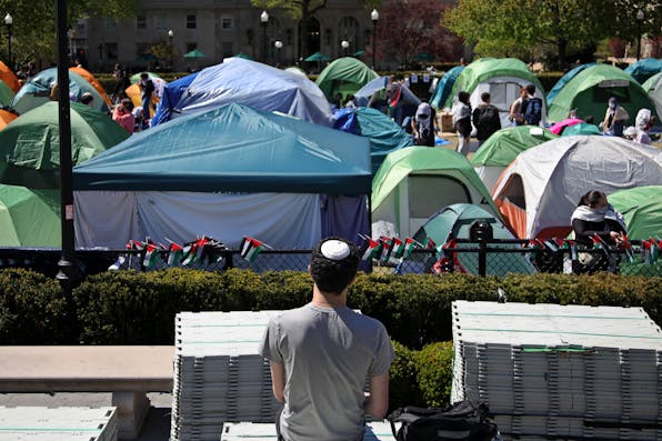 A Jewish student looks at an anti-Israel encampment at Columbia University in New York City on April 25, 2024. Photo by Leonardo Munoz/AFP via Getty Images. A Jewish student looks at an anti-Israel encampment at Columbia University.
