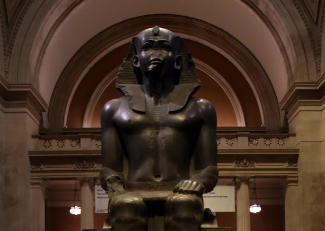 Colossal Seated Statue of a Pharaoh in the Great Hall of the Metropolitan Museum of Art (ELEPHOTOS / Shutterstock) Colossal Seated Statue of a Pharaoh in the Great Hall of the Metropolitan Museum of Art (ELEPHOTOS / Shutterstock)