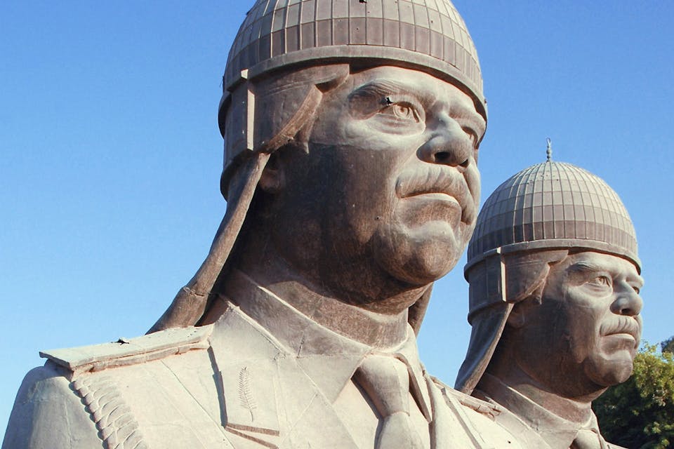 *Thirty-foot-tall bronze sculptures of Saddam Hussein, which once sat atop the towers in his palace, 2005*. Jim Gordon/U.S. Department of Defense. *Thirty-foot-tall bronze sculptures of Saddam Hussein, which once sat atop the towers in his palace, 2005*. Jim Gordon/U.S. Department of Defense.