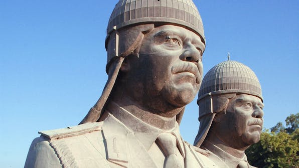 *Thirty-foot-tall bronze sculptures of Saddam Hussein, which once sat atop the towers in his palace, 2005*. Jim Gordon/U.S. Department of Defense.