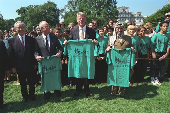 Clinton, Rabin, Arafat holding up T-shirts celebrating peace deal (White House Photograph Office via Wikimedia) Clinton, Rabin, Arafat holding up T-shirts celebrating peace deal (White House Photograph Office via Wikimedia)