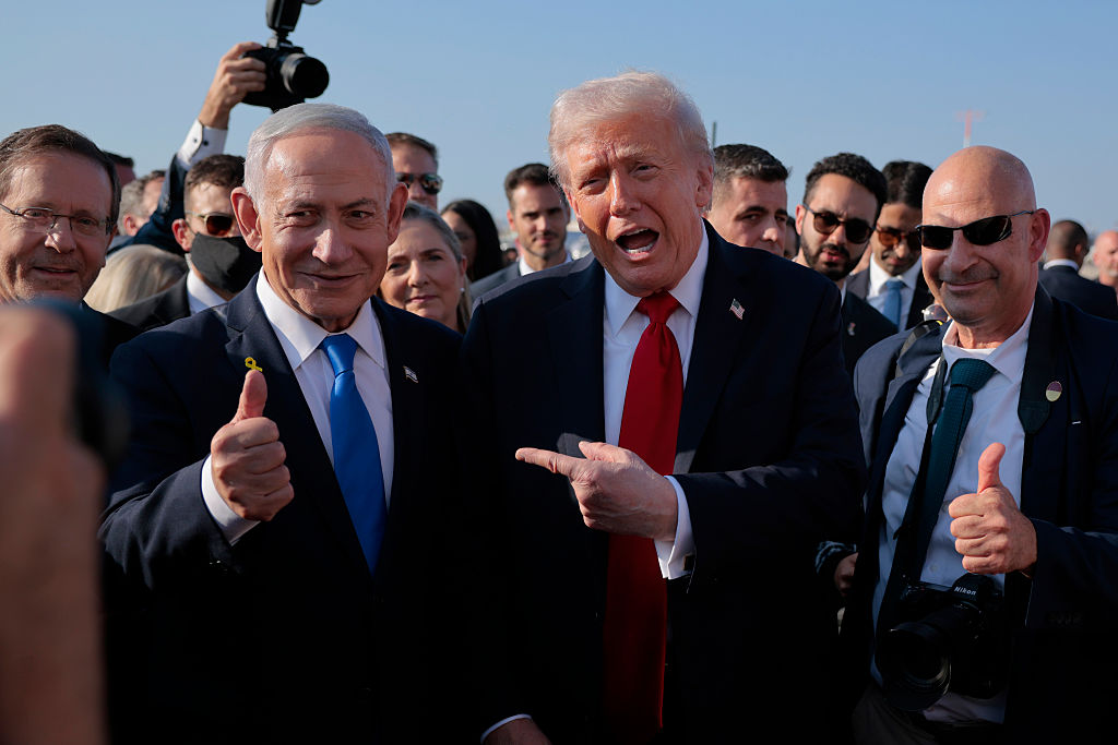 Isaac Herzog, Benjamin Netanyahu, and Donald Trump speaks to Israeli Prime Minister Benjamin Netanyahu, October 13, 2025. (Chip Somodevilla/Getty Images)