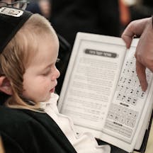 Boy learning Hebrew alphabet