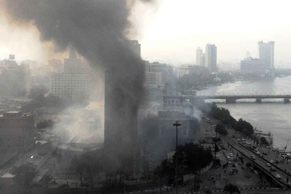 National Democratic Party Headquarters in Cairo burning on 29 January 2011 (Alisdare Hickson, Wikimedia Commons) National Democratic Party Headquarters in Cairo burning on 29 January 2011 (Alisdare Hickson, Wikimedia Commons)