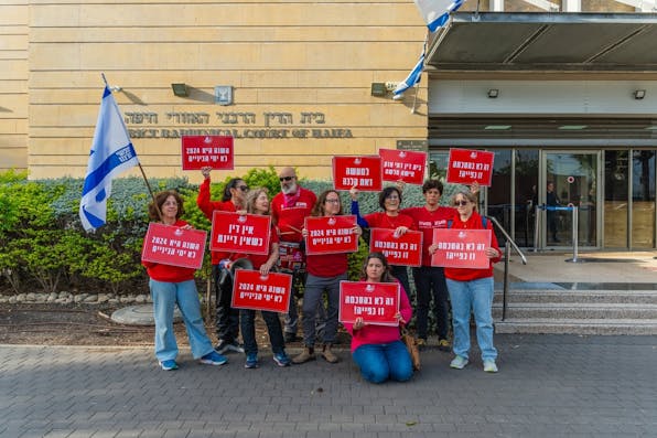 Activist group Bonot Alternativa protests near the Rabbinical Court in Haifa, Israel (Shutterstock) Activist group Bonot Alternativa protests near the Rabbinical Court in Haifa, Israel (Shutterstock)