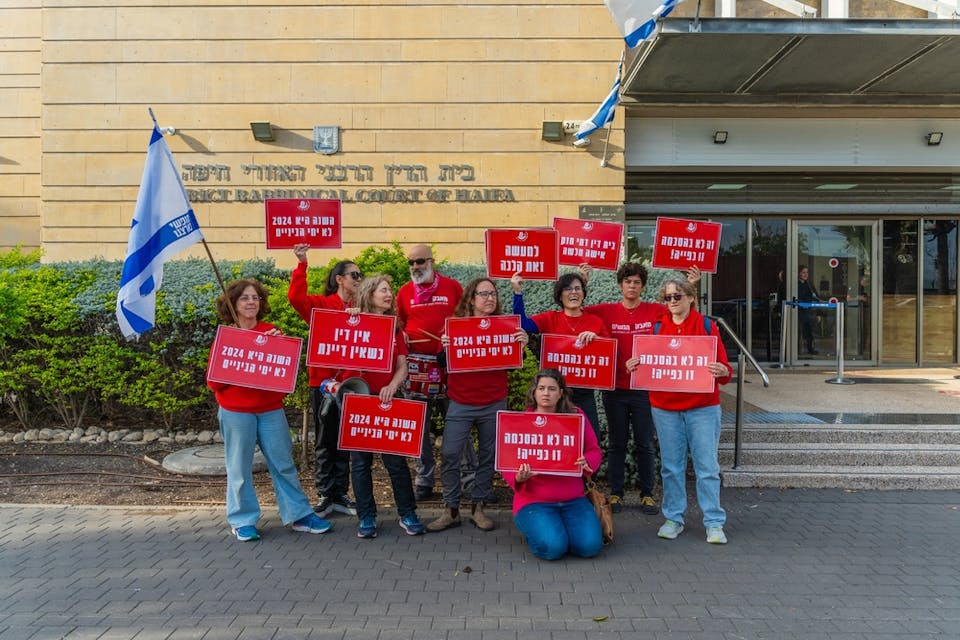 Activist group Bonot Alternativa protests near the Rabbinical Court in Haifa, Israel (Shutterstock)