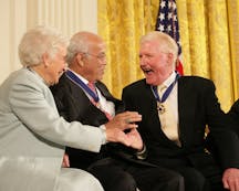 Paul Johnson is congratulated by Dr. Norman C. Francis and Ruth Johnson Colvin after receiving the Presidential Medal of Freedom from President George W. Bush in 2006 (Wikimedia Commons)