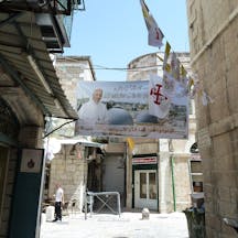 Old Jerusalem, New Gate St., banner and flags for the visit of Pope Francis, May 2014 (Djampa, Wikimedia Commons) Old Jerusalem, New Gate St., banner and flags for the visit of Pope Francis, May 2014 (Djampa, Wikimedia Commons)