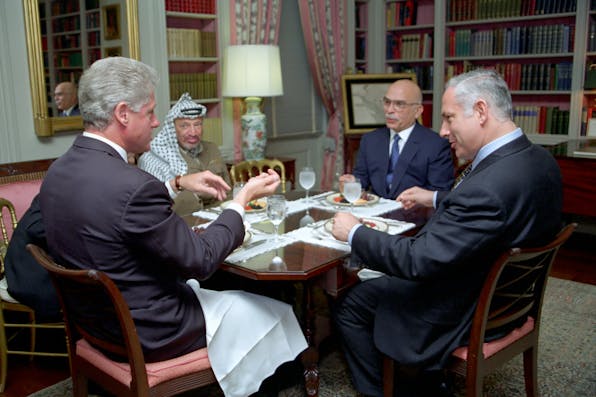 President Bill Clinton has lunch with King Hussein of Jordan, Prime Minister Benjamin Netanyahu of Israel, and Chairman Yasser Arafat of the Palestinian Authority (Wikimedia Commons) President Bill Clinton has lunch with King Hussein of Jordan, Prime Minister Benjamin Netanyahu of Israel, and Chairman Yasser Arafat of the Palestinian Authority (Wikimedia Commons)