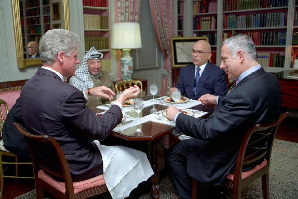 President Bill Clinton has lunch with King Hussein of Jordan, Prime Minister Benjamin Netanyahu of Israel, and Chairman Yasser Arafat of the Palestinian Authority (Wikimedia Commons) President Bill Clinton has lunch with King Hussein of Jordan, Prime Minister Benjamin Netanyahu of Israel, and Chairman Yasser Arafat of the Palestinian Authority (Wikimedia Commons)