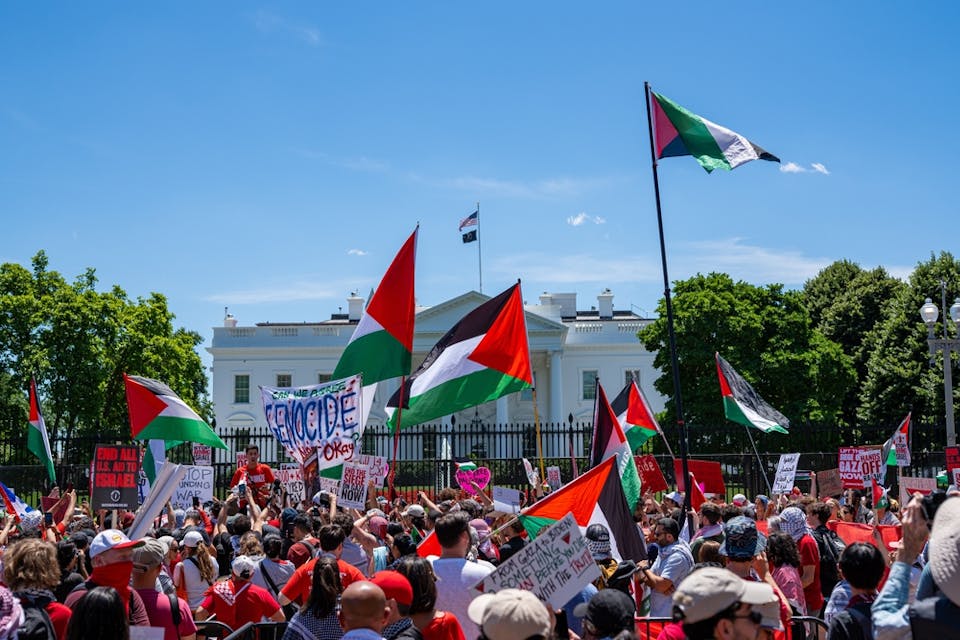 Washington, DC- June 8th, 2024: Pro-Palestine protesters and Palestine flags outside the White House. (Shutterstock)