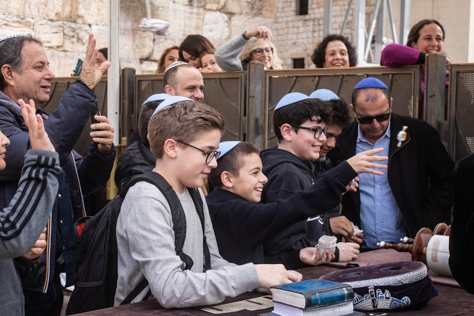 Family celebrating a bar mitzvah at the Kotel in Jerusalem (Shutterstock)