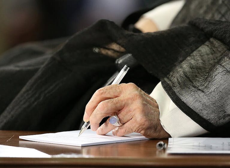 Ali Khamenei signing a document. Wikimedia Commons. Ali Khamenei signing a document. Wikimedia Commons.