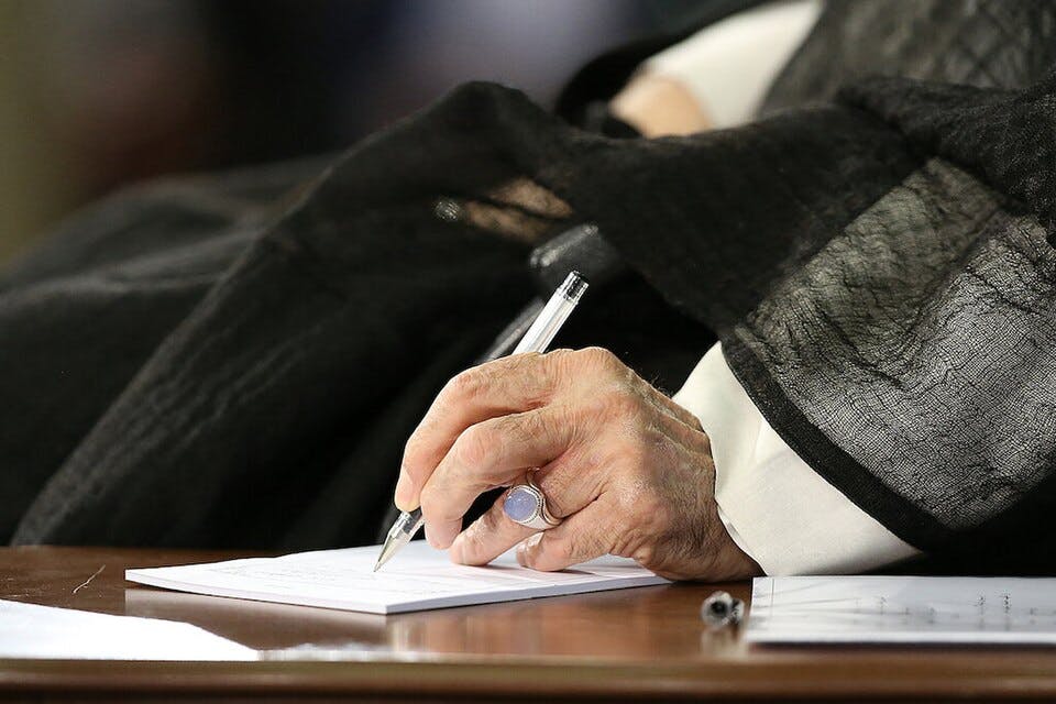 Ali Khamenei signing a document. Wikimedia Commons. Ali Khamenei signing a document. Wikimedia Commons.