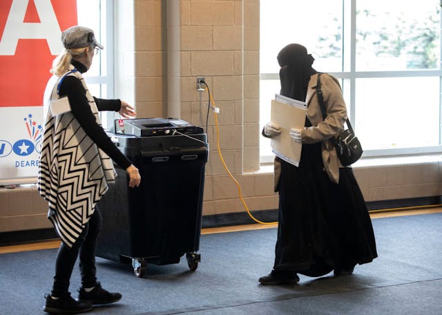 Voters cast their ballots on October 29, 2024 in Dearborn, Michigan. (Bill Pugliano/Getty Images) Voters-cast-their-ballots