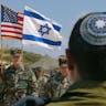 Israeli and American personnel at the IDF’s Tel Yona base on April 20, 2003. (David Silverman/Getty Images) Israeli-and-american-personnel