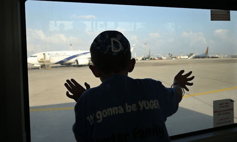 Watching Jewish immigrants arrive at Ben-Gurion Airport, August 17, 2016. (Gali Tibbon/AFP via Getty Images) Watching Jewish immigrants arrive at Ben-Gurion Airport, August 17, 2016. (Gali Tibbon/AFP via Getty Images)