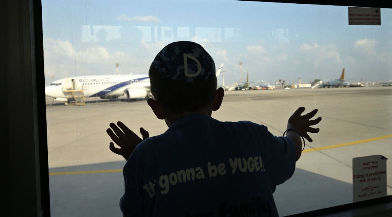 Watching Jewish immigrants arrive at Ben-Gurion Airport, August 17, 2016. (Gali Tibbon/AFP via Getty Images) Watching Jewish immigrants arrive at Ben-Gurion Airport, August 17, 2016. (Gali Tibbon/AFP via Getty Images)