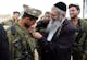 A member of a haredi IDF battalion receives a unit pin from a rabbi, March 2007. (Menahem Kahana/AFP via Getty Images)