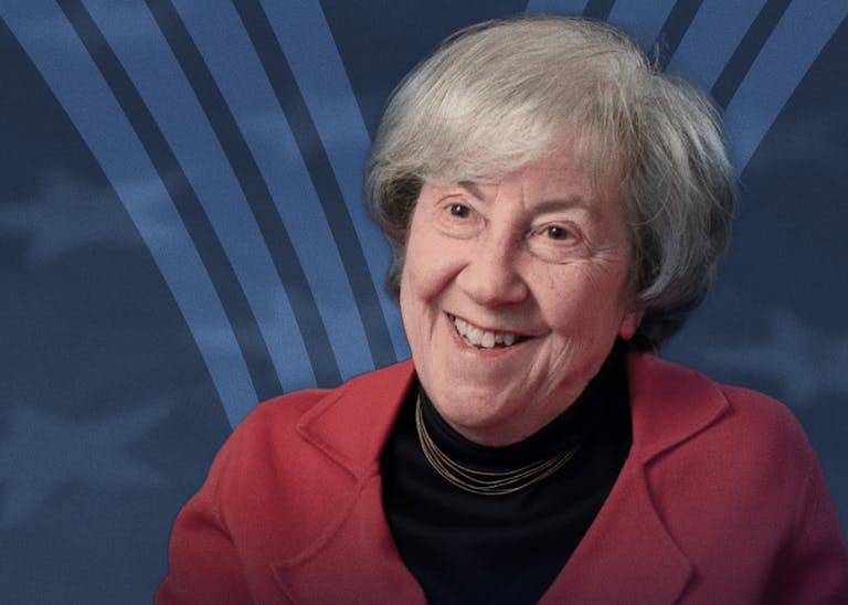 Ruth Wisse in front of an American flag