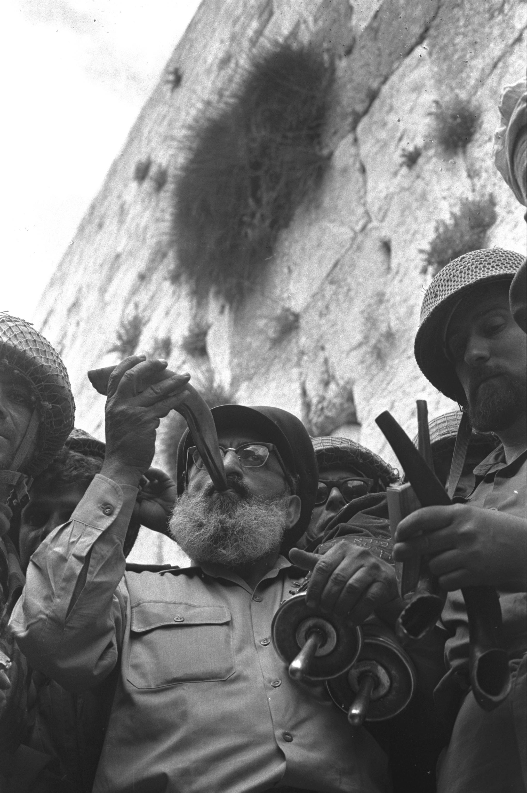 Chief Rabbi of the IDF, Rabbi Shlomo Goren, blowing the shofar in front of the Western Wall in Jerusalem. The Six-Day War, 7 June 1967. (Wikimedia)