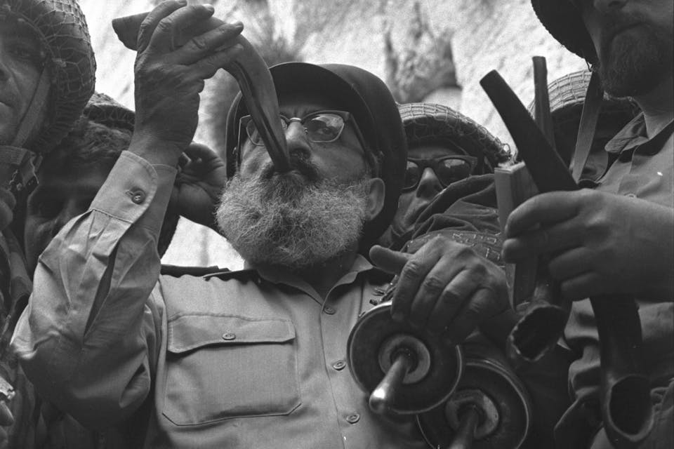 Chief rabbi of the IDF, Shlomo Goren, blowing the shofar in front of the Western Wall during the Six-Day War. (Wikimedia) Chief Rabbi of the IDF, Rabbi Shlomo Goren, blowing the shofar in front of the Western Wall in Jerusalem. The Six-Day War, 7 June 1967. (Wikimedia)