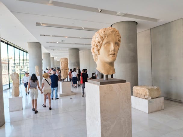 ATHENS, GREECE – JULY 7, 2025: A marble bust of Alexander the Great stands proudly among other antiquities, symbolizing Greece’s vast historical legacy. (Shutterstock)