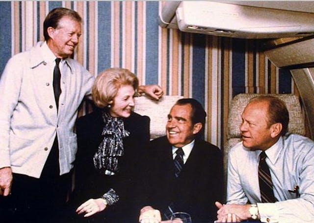 Former U.S. Presidents Jimmy Carter, Richard Nixon and Gerald Ford, pose with U.S. Chief of Protocol Leonore Annenberg during their flight from Washington to attend the funeral of Egyptian President Anwar Sadat in 1981. Former U.S. Presidents Jimmy Carter, Richard Nixon and Gerald Ford, pose with U.S. Chief of Protocol Leonore Annenberg during their flight from Washington to attend the funeral of Egyptian President Anwar Sadat in 1981.