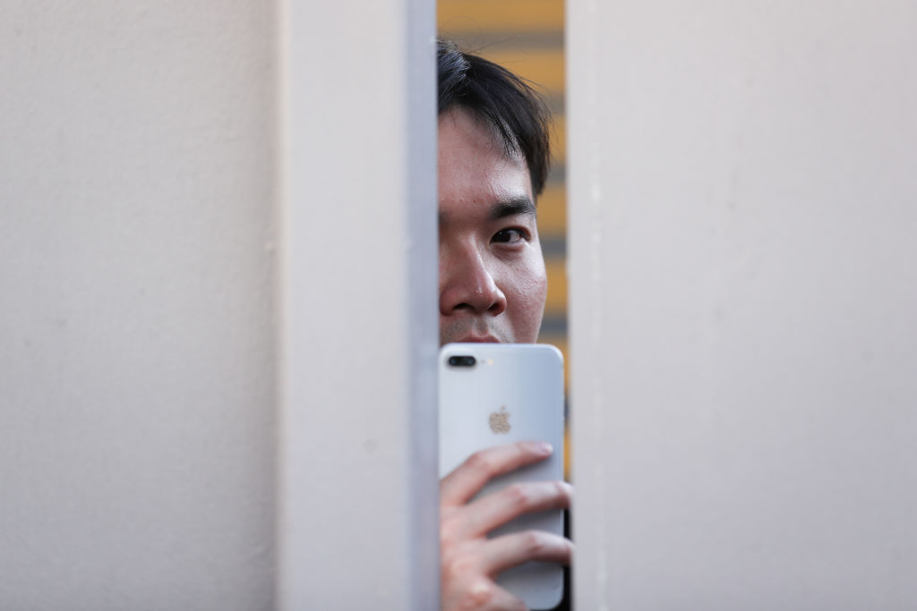 A soccer fan watches players during a match in London, 2023 (Jacques Feeney/Offside via Getty Images)