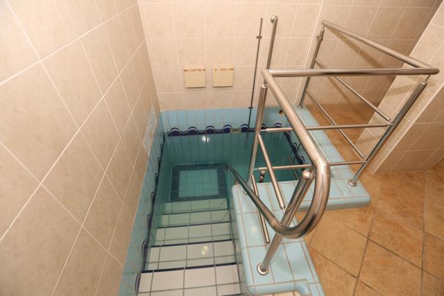 Ritual bath used for spiritual purification. Blessing on the wall in Hebrew translates: Blessed are you Lord for the commandment of immersion"