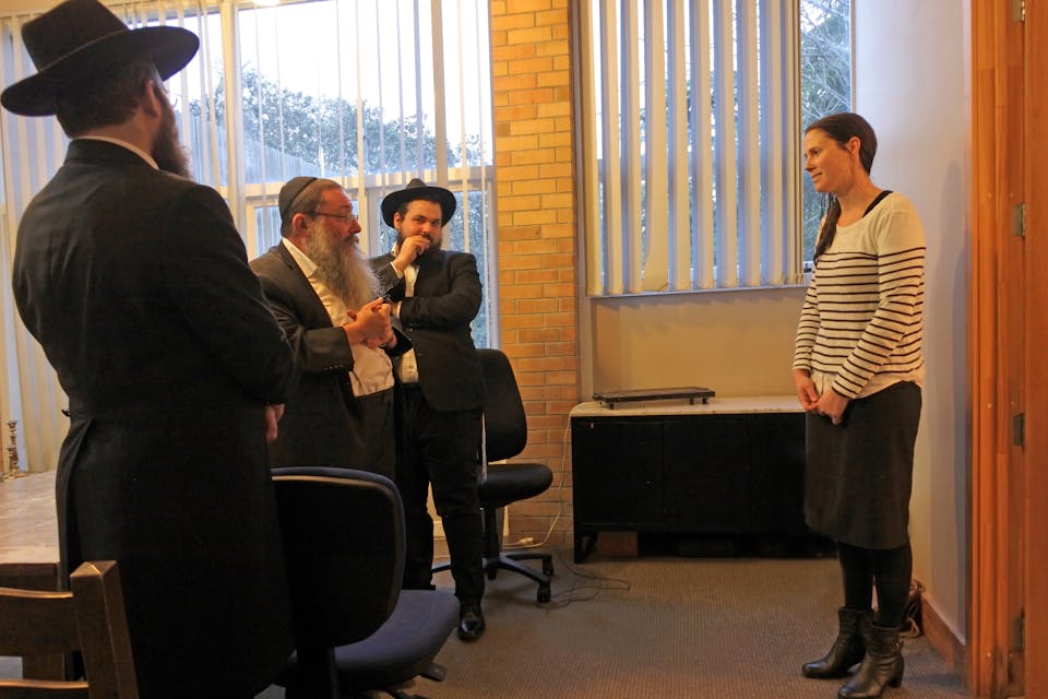 AUCKLAND - OCT 17 2108:Non Jewish woman converting to Judaism standing in front of Jewish court of law (Shutterstock) AUCKLAND - OCT 17 2108:Non Jewish woman converting to Judaism standing in front of Jewish court of law (Shutterstock)
