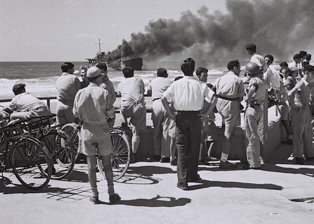 Watching the Altalena burn. (Israel Government Press Office via Wikimedia.) Watching the Altalena burn. (Israel Government Press Office via Wikimedia.)