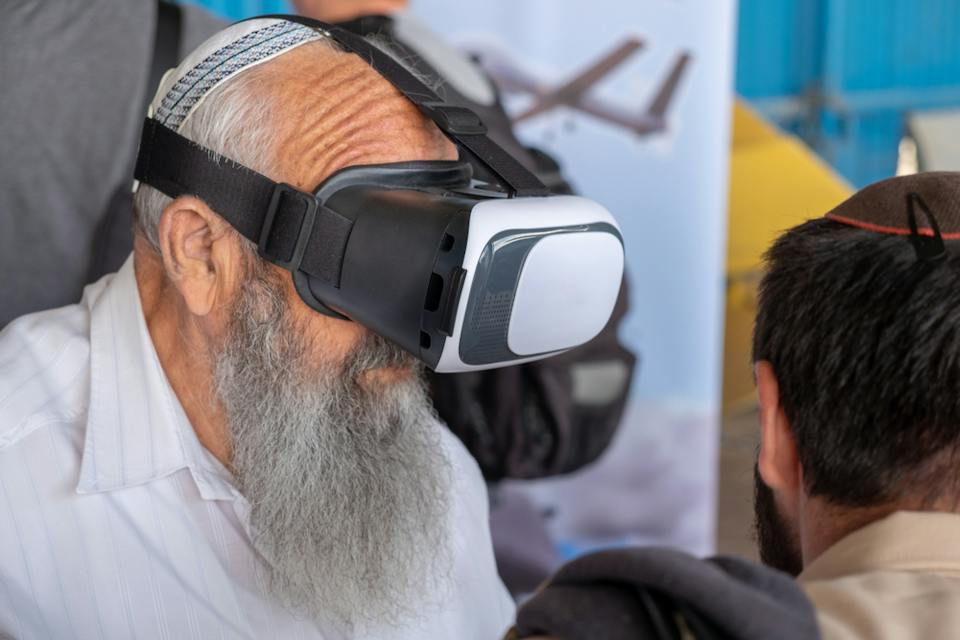 Orthodox man wearing VR headset glasses (Shutterstock)