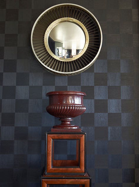 Ingrao Inc, circular mirror hanging over an urn
